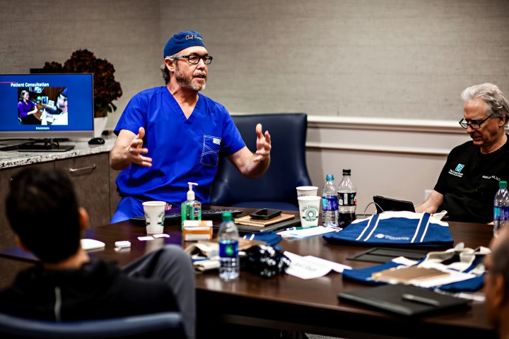 Dr. Anderson in discussion with a fellow doctor